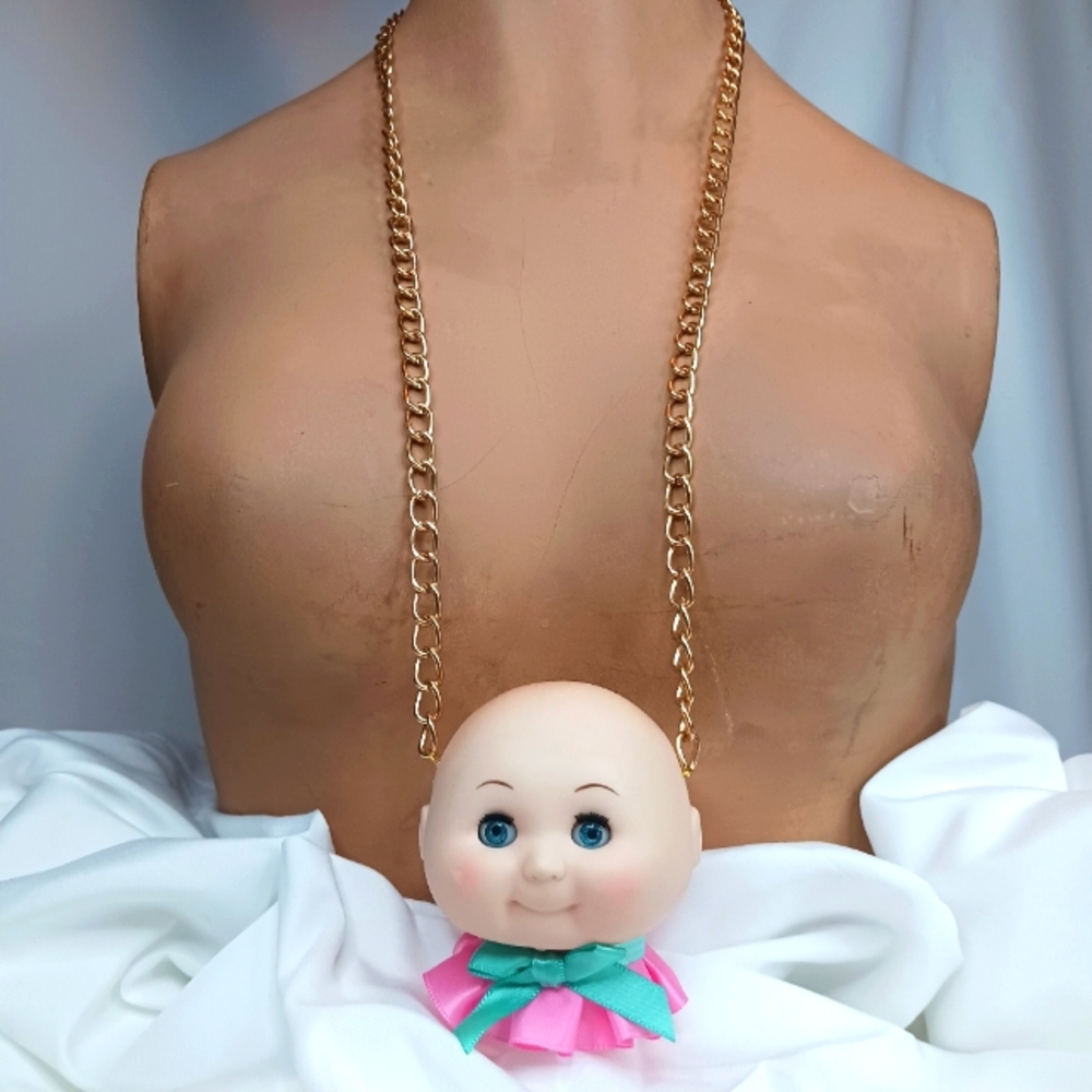 Vintage Doll Head with Ruffle & Bow Necklace.
